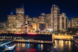 San Francisco Skyline And Ferry Building At Night With Holiday C